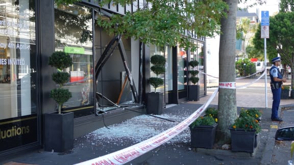 Glass can be seen littering the street at the International Art Centre, in Parnell, after the ram-raid in which two Gottfried Lindauer paintings were stolen.