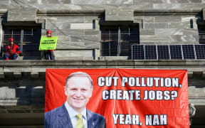 Protesters on the roof of parliament.