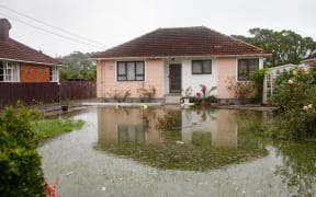 The home of Kannan Thiru was surrounded by a large pool of water still on Wednesday afternoon.
