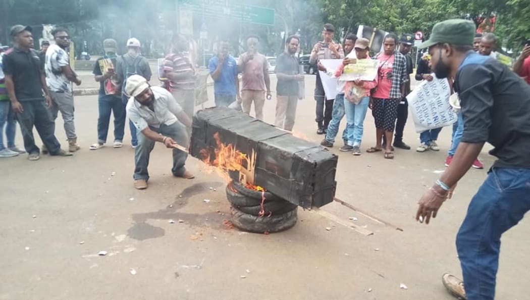 Student protesters burning a coffin in Jakarta on 18 January, 2019.