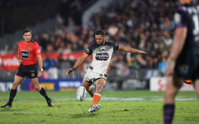 Tigers captain Benji Marshall kicking a field goal in the NRL