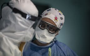 Doctors with protective glasses, protective suits and masks before applying a treatment for a coronavirus patient at Istanbul University Medical Faculty Hospital in Istanbul, Turkey