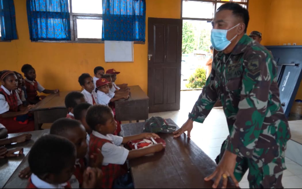 Indonesian military officer addresses a school class in West Papua, September 2021