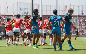 Sunwolves celebrate victory over the Blues