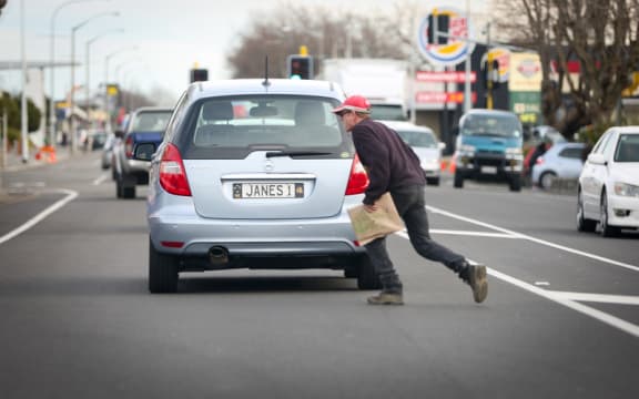 Pedestrian crossing the road in Levin.
