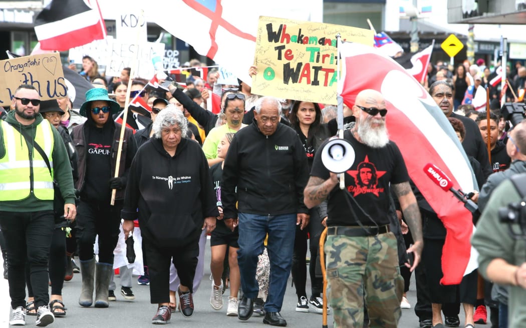 Paturiri Toatau leading this week's hikoi calling for the resignation of Kaipara's Mayor through the main streets of Dargaville.