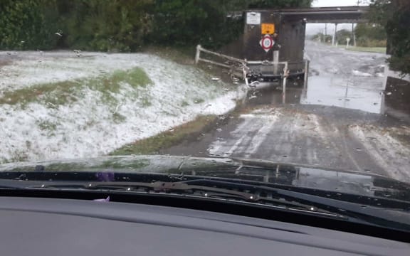 A thick layer of hail is seen through a car window in Ōhau, Horowhenua District, following an extreme weather event on 20 May, 2022.