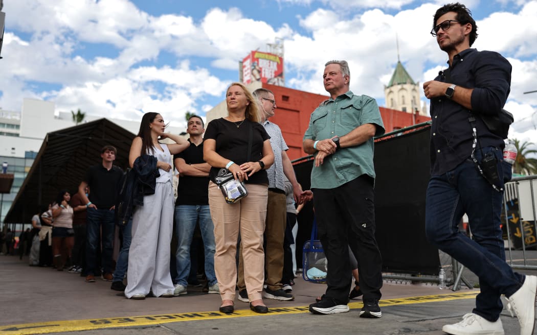 Fans wait in line to view the recording of the "Jimmy Kimmel Live!" show in Hollywood on the first night the show will return to the ABC lineup.