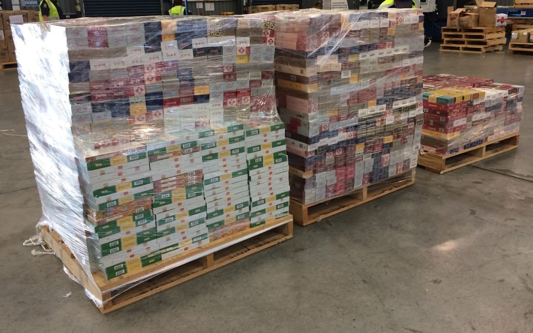 Cigarette cartons from inside the boxes in shipping container.
