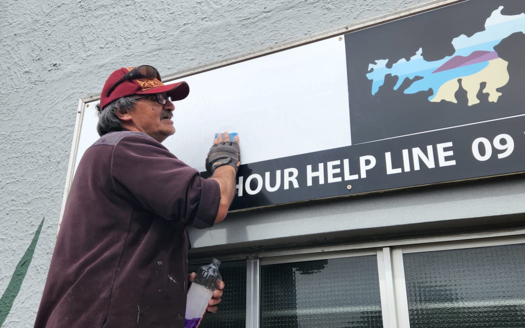 The Oranga After Hours clinic's signage being removed.