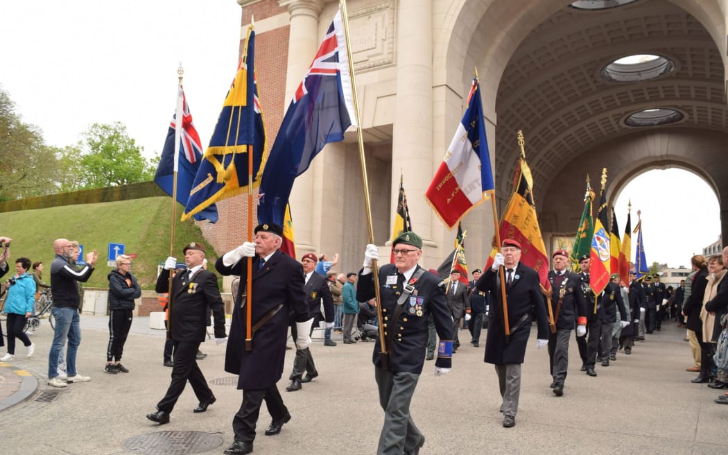 The street procession to the Menin Gate in Ypres, where the names of nearly 55,000 soldiers whose graves are unknown are inscribed.