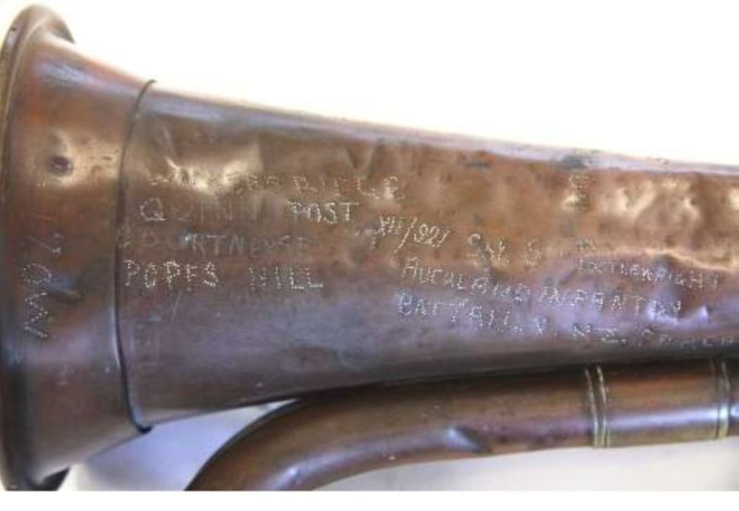 Bugle with engravings showing Sergeant Postlewaight’s number, rank and name and Gallipoli locations.