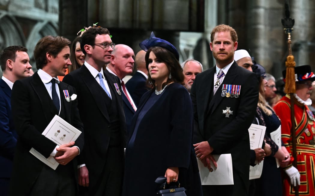 Prince Harry looks on as King Charles III leaves Westminster Abbey after the Coronation Ceremonies in central London on May 6, 2023. - The set-piece coronation is the first in Britain in 70 years, and only the second in history to be televised. Charles will be the 40th reigning monarch to be crowned at the central London church since King William I in 1066. Outside the UK, he is also king of 14 other Commonwealth countries, including Australia, Canada and New Zealand. (Photo by Ben Stansall / POOL / AFP)