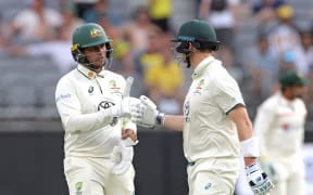 Usman Khawaja and Steve Smith of Australia leave the field at stumps on Day 3 of the first Test match between Australia and Pakistan at Optus Stadium in Perth, Saturday, December 16, 2023. (AAP Image/Richard Wainwright / www.photosport.nz)