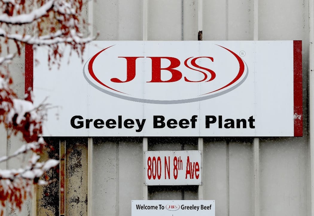 (FILES) In this file photo taken on April 16, 2020, the Greeley JBS meat packing plant sits idle in Greeley, Colorado.