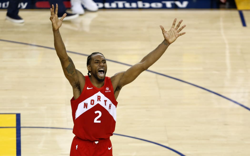 Kawhi Leonard of the Toronto Raptors celebrates his teams win.