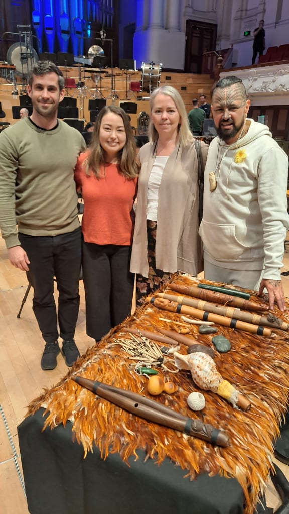 Conductor Vincent Hardaker, composer Salina Fisher, APO Artistic Manager Gale Mahood, and taonga puoro specialist Jerome Kavanagh behind Kavanagh's table of instruments for the world premiere of Fisher's Papatūānuku.