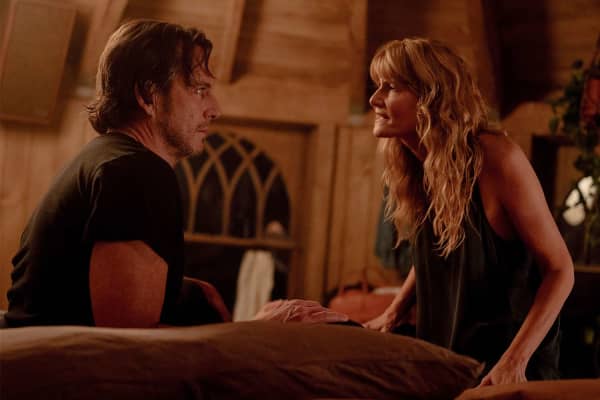 Will Arnett and Laura Dern have an intense conversation in a darkened living room.
