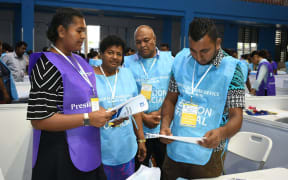 Election and poll workers at the Suva results center.