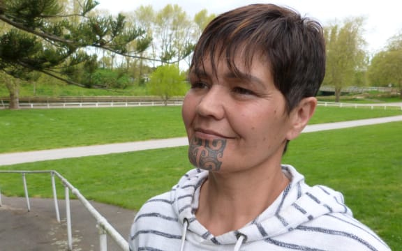 Head shot of young Marori woman with moko kauae