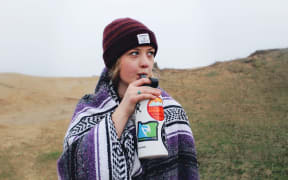 girl drinking from water bottle