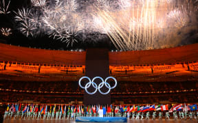 Fireworks explode over the Olympic rings during the opening ceremony of the Beijing 2022 Winter Olympic Games, at the National Stadium, known as the Bird's Nest, in Beijing, on February 4, 2022.