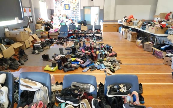 Puketapu School hall is full of donated food and clothes for people in need to pick up.