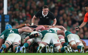 All Blacks halfback Cam Roigard encourages the pack during a scrum.