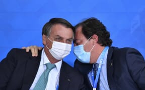 Brazilian President Jair Bolsonaro and  president of Caixa, Pedro Guimaraes.