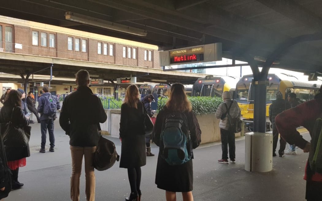 Commuters wait for trains at Wellington Railway Station after a power fault this morning.