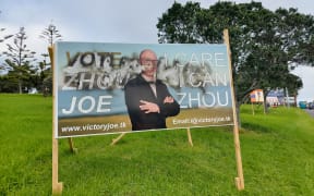Kaipātiki Local Board candidate Joe Zhou has had at least eight of his billboards vandalised with a racist word. Fellow candidates and friends have helped Zhou remove the words from his billboards.