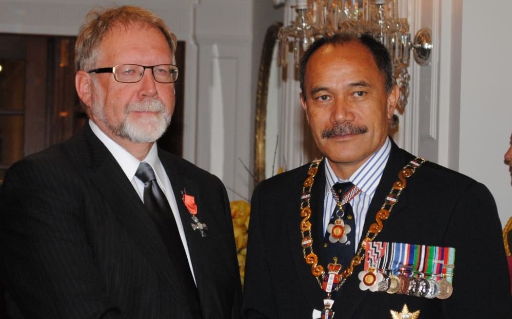 Dr John Angus (left) being awarded his New Zealand Order of Merit by Governor-General Sir Jerry Mateparae.