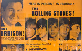 The Rolling Stones 1965 NZ tour poster printed on yellow coloured paper advertising Roy Orbison and The Rolling Stones with images of the artists.