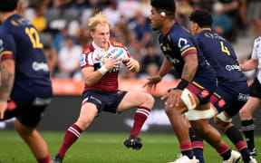 DUNEDIN, NEW ZEALAND - MARCH 22: Tom Lynagh of the Reds 
charges forward during the round six Super Rugby Pacific match between Highlanders and Queensland Reds at Forsyth Barr Stadium, on March 22, 2025, in Dunedin, New Zealand. (Photo by Joe Allison/Getty Images)