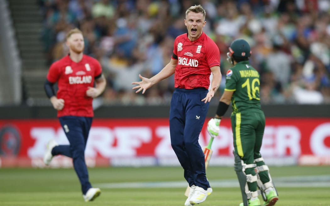 England's Sam Curran celebrates the wicket of Pakistan's Muhammad Rizwan during the ICC Men’s T20 World Cup Finals between England and Pakistan at the Melbourne Cricket Ground.