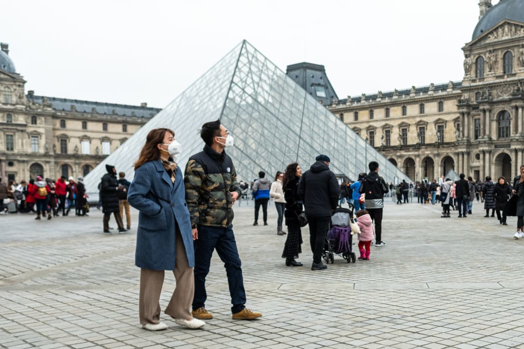Chineese tourists wear face mask near the Louvre Museum in Paris, France, on 26 January 2020. (Photo by Jerome Gilles/NurPhoto)
