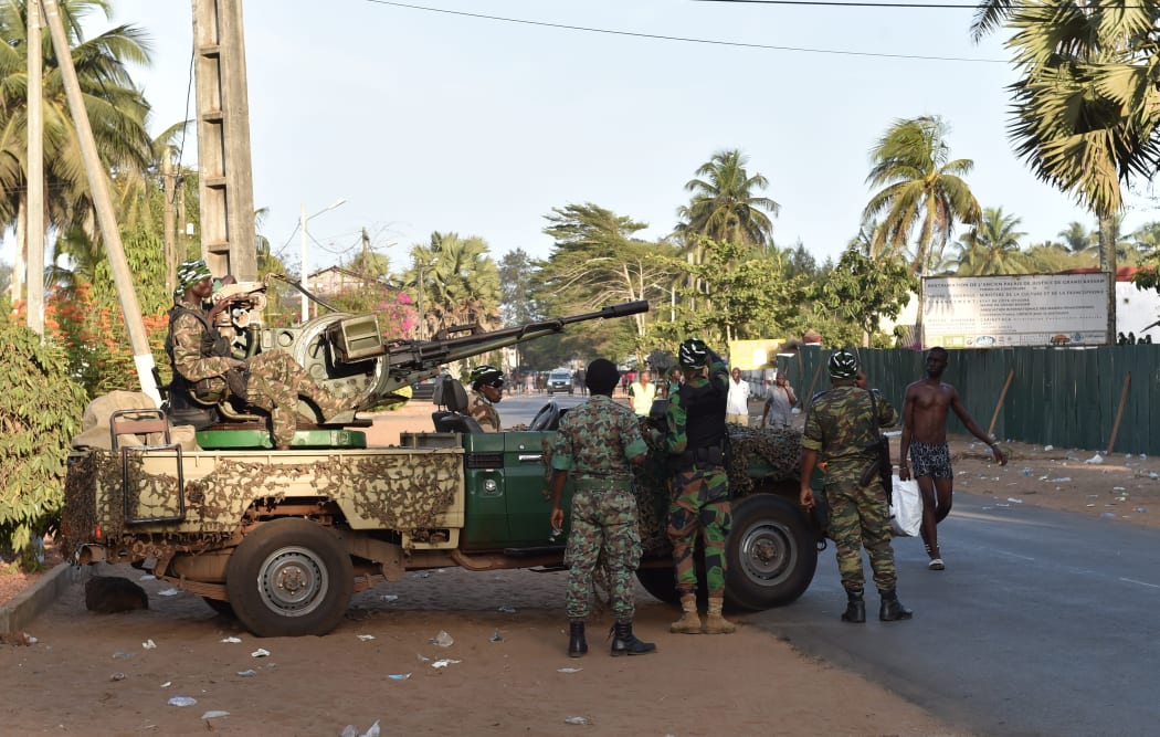 Ivory Coast's armed forces take position after heavily-armed gunmen opened fire on March 13, 2016 in the Ivory Coast resort town of Grand-Bassam, leaving bodies strewn on the beach.