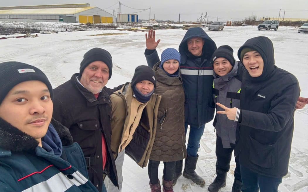 Berwick Settle with a group of translators and calf team leaders in the snow