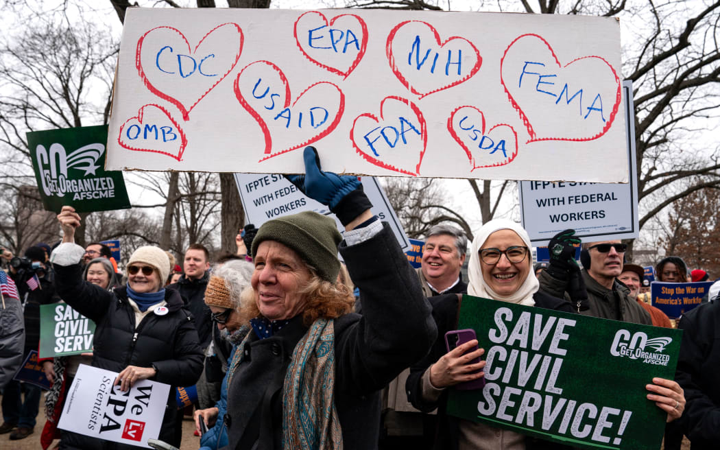 People gather for a "Save the Civil Service" rally hosted by the American Federation of Government Employees (AFGE) outside the US Capitol on 11 February 2025 in Washington, DC.