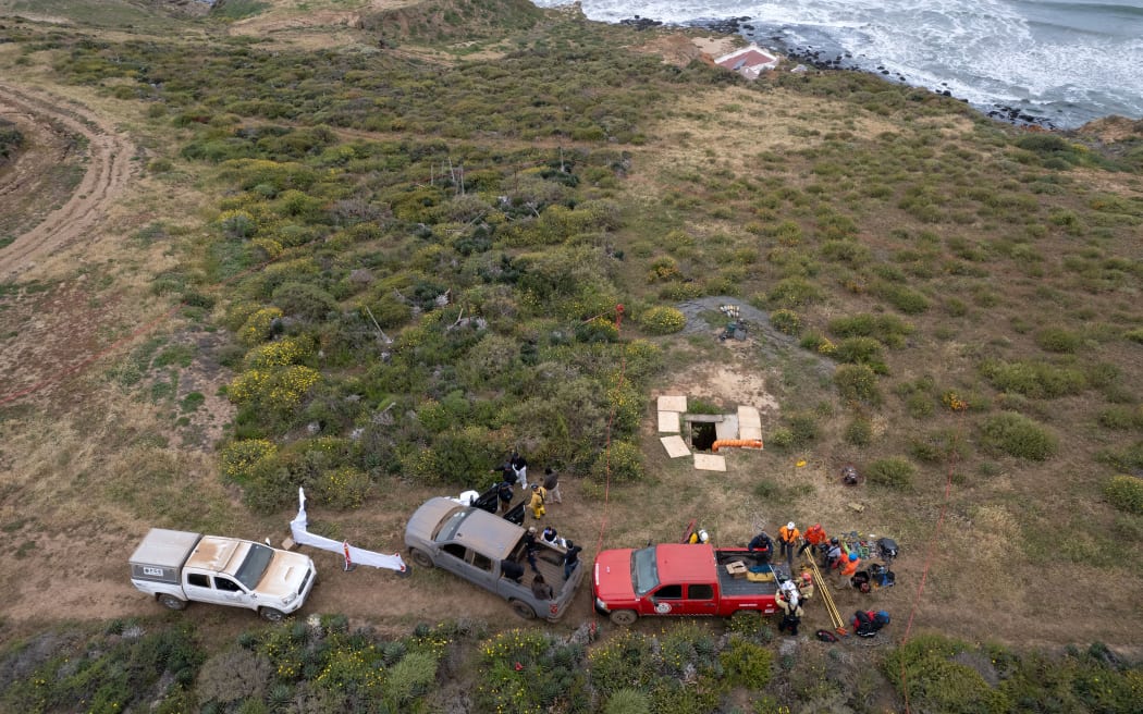 Rescue workers, forensics, and prosecutors preparing to enter a waterhole where human remains were found near La Bocana Beach, in Ensenada, Mexico, on 3 May, 2024.