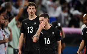 Dejected All Whites players Lukas Kelly-Heald (L) and Fin Conchie  after their 3-0 loss to France at the Paris Olympics 2024 Football game between All Whites vs France at Marseille Stadium, Stade Vélodrome, in Marseille, France.