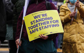 Healthcare workers hold placards at a picket line in Wellington. Nurses, midwives and healthcare assistants were on strike for 24 hours from 9am Wednesday 30 July 2025.