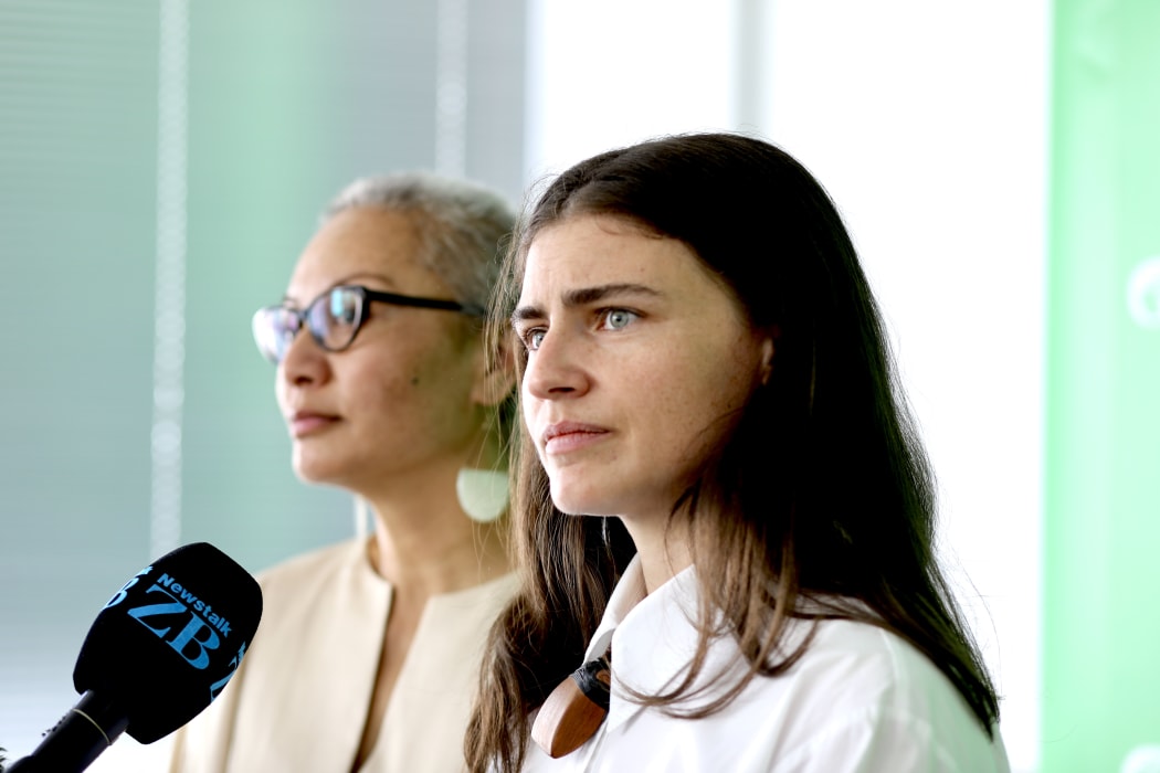 Chloe Swarbrick with Marama Davidson in background