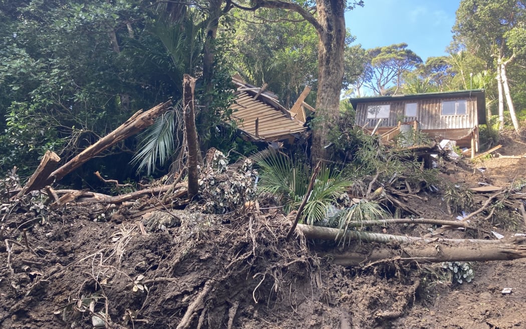 Houses came toppling down in Karekare after 16 slips in the area due to Cyclone Gabrielle.