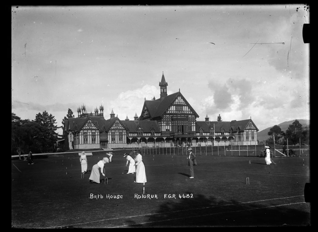 1910: Women playing croquet on the lawn in front of the Rotorua Bath House in the Government Sanitorium Grounds.