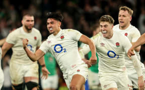 England’s Marcus Smith celebrates kicking a drop goal to win their match against Ireland.