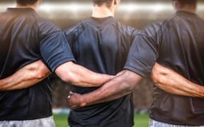 Rugby players lock arms