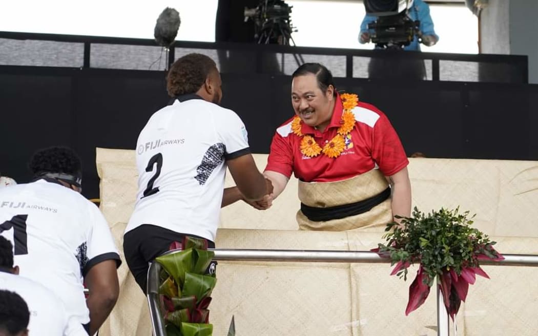 Tonga's Crown Prince Tupouto'a meets Fijian captain Tevita Ikanivere before the match.