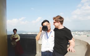 Architect photographer Dave Kulesza (right) and one of his guides in North Korea.