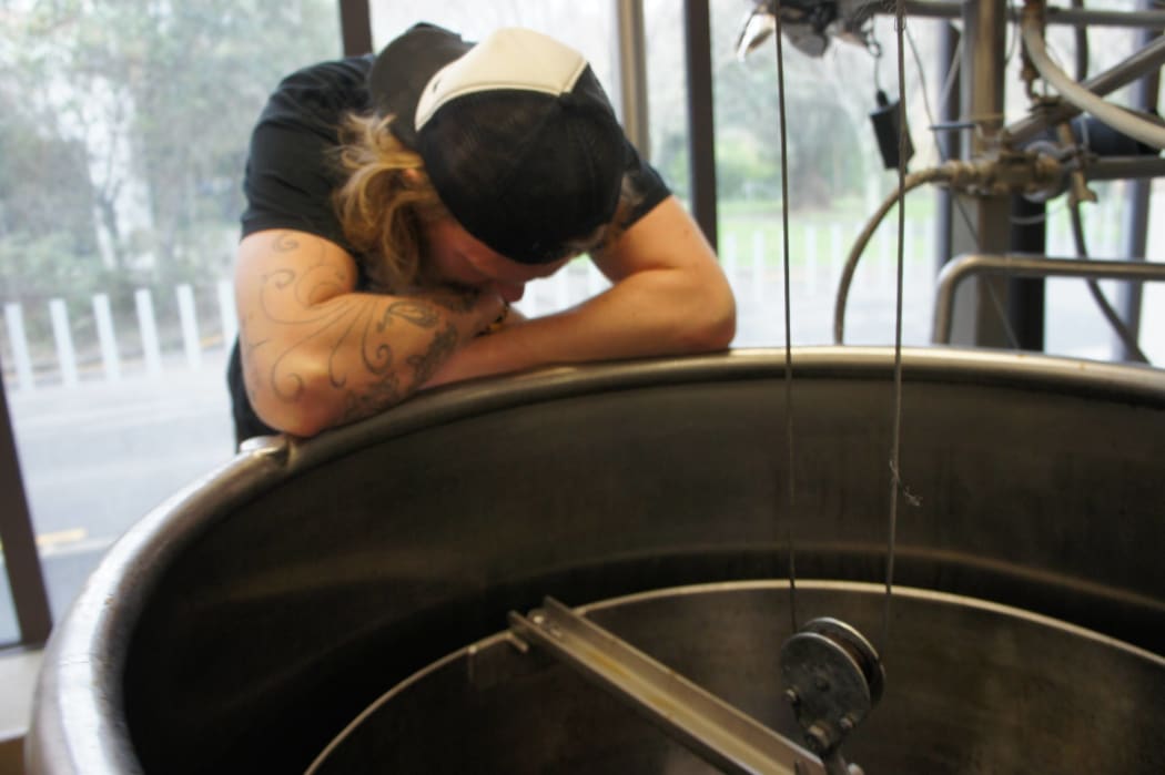 Kerry Gray waits for a "stuck sparge" to clear.